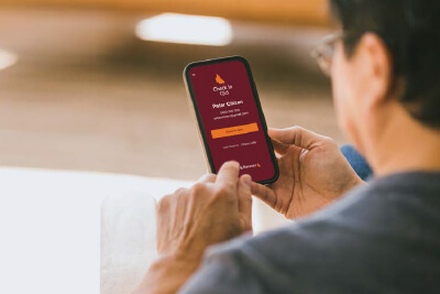 Person using COVID check in app
